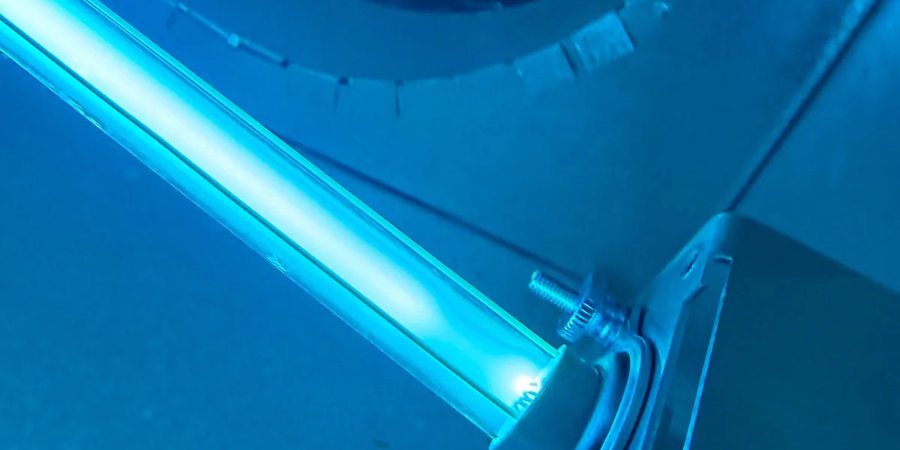 UV light installed in-duct, glowing blue — Air Haven